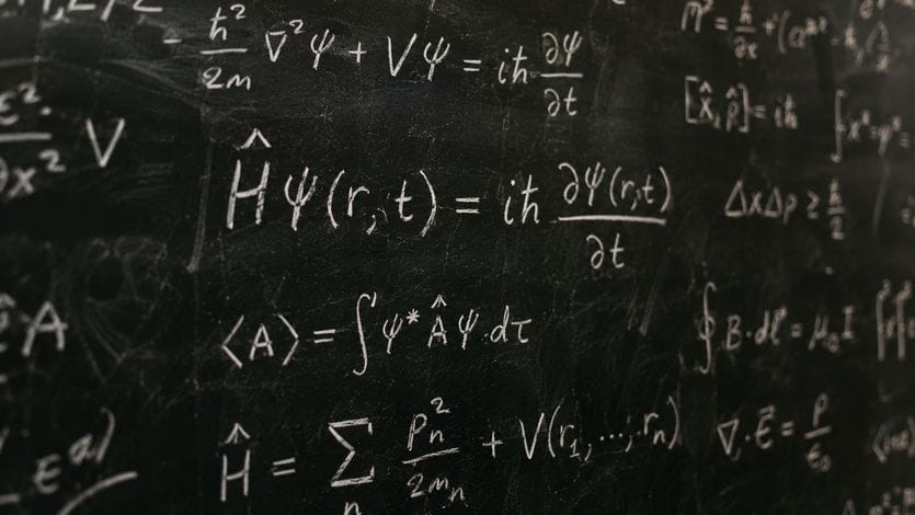 Chalkboard with math formulas representing data analytics